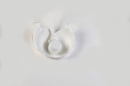 collection of various milk splashes on white background. cosmetics milk, white paint splash, perfume, drop and hit concept.の写真素材