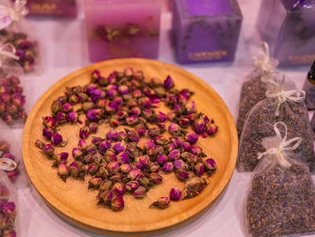 Dried rose buds on a ceramic plate. Tea and aroma concept