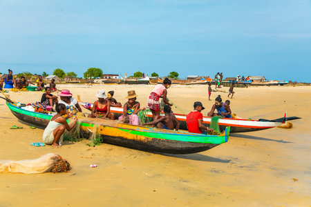 Batavia,western Madagascar, Toliara province.18 october 2023. Inhabitants Madagascar traditional fishing village fold their nets after small catch on ocean shoreの写真素材