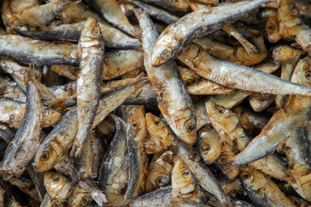 big pile small fish chips or flakes, dried and cured fish pieces, used in small amounts in sri lankan and maldivian cooking, strong flavor and aromatic ingredient, food background textureの写真素材