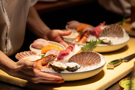 Exquisite sushi platter is being served by a chef, showcasing fresh seafood, garnishes, and ice,...