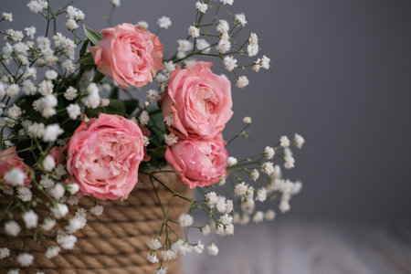 Delicate bouquet of flowers in a basketの写真素材