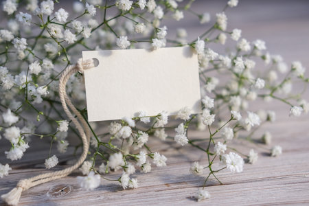 White flowers and blank white card for text. Mockup tag. Postcardの写真素材