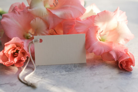 Bouquet of flowers and blank white card for text. Mockup tag. Postcardの写真素材