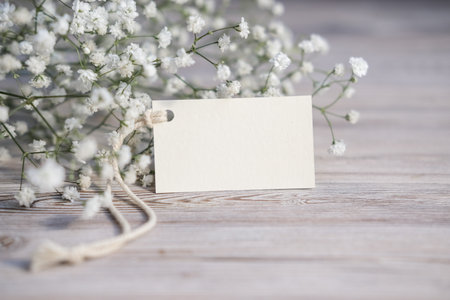 White flowers and blank white card for text. Mockup tag. Postcardの写真素材