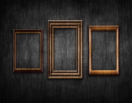 Vintage style wood framework over old black wall background. Space for text. 3d illustrationの写真素材