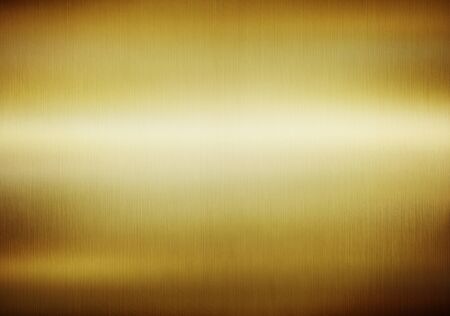 Gold metal  background with polished, brushed texture for designの写真素材