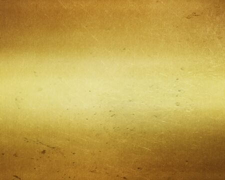 Gold metal  background with polished, brushed texture for designの写真素材