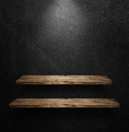 brown wooden shelves on a black wall background, surface texture 3D illustrationの写真素材