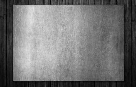 Old steel plate on black wooden plank background. Vintage template metal plate on dark background. 3d illustrationの写真素材