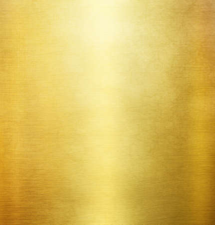 Gold polished metal texture or abstract stainless steel background.の写真素材