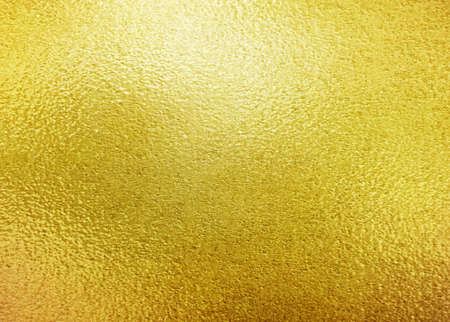 Gold metal texture or yellow leaf foil backgroundの写真素材