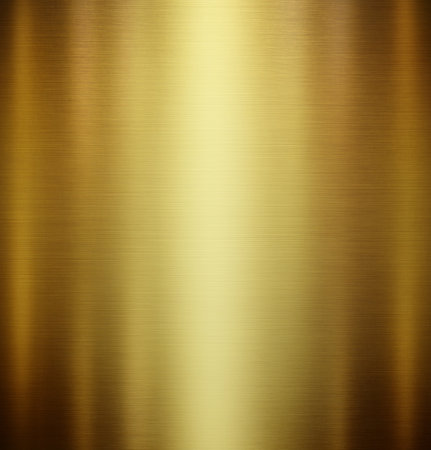Gold polished metal texture. Shiny background with space for design.の写真素材