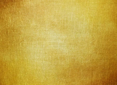 Gold polished metal texture. Abstract background with space for design.の写真素材