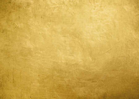 Gold metal old background or texture. Yellow steel plate.の写真素材