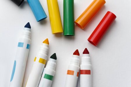 Colored markers on white paperの写真素材