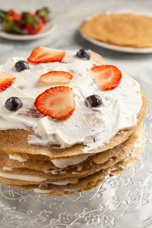 Making cooking pancake cake on a grau background close-up. Home cookingの写真素材