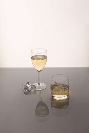 green tea kombucha in a glass with ice cubes on acrylic glassの写真素材