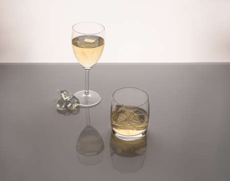green tea kombucha in a glass with ice cubes on acrylic glassの写真素材
