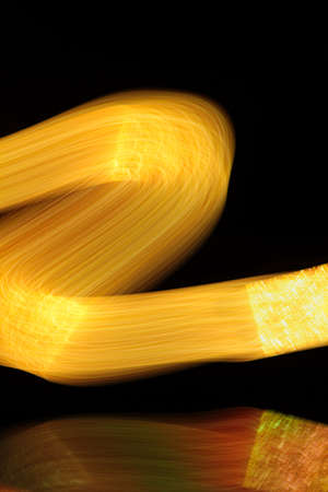 color yellow flow on a black backgroundの写真素材