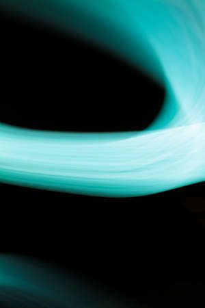 Aqua color flow on a black backgroundの写真素材