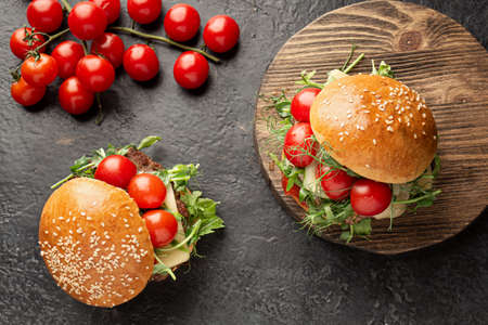 ready-made hot burger on the cutting board. Flat layの写真素材