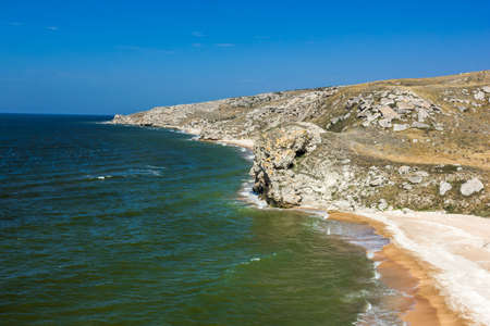 stone cliffs on the coast and blue skyの写真素材