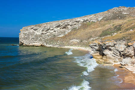 stone cliffs on the coast and blue skyの写真素材