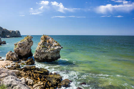 stone cliffs on the coast and blue skyの写真素材