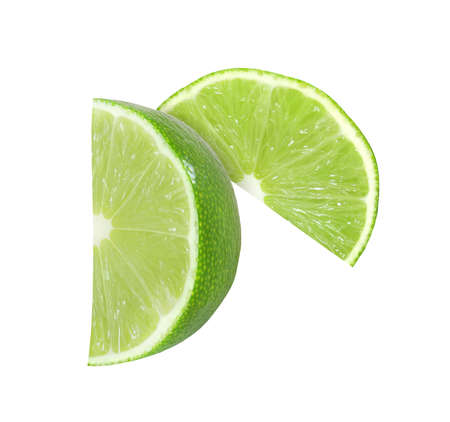 lime fruit slices isolated on a white backgroundの写真素材