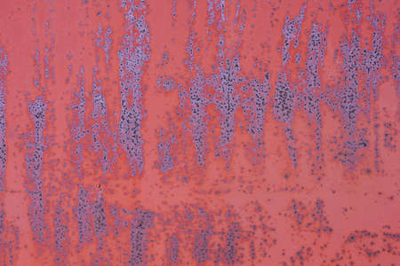painted with red paint metal surface with rust abstract texture backgroundの写真素材
