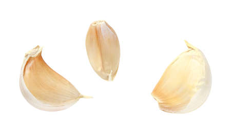 Pieces  broken garlic  on white background   .の写真素材