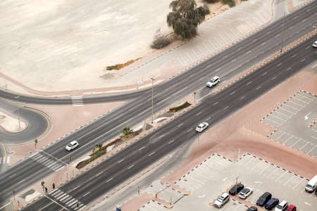 Roadway, cars on the road, intersection with traffic lights, pedestrian crossing, top view.