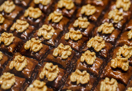 Baklava with chocolate and whole walnuts, many square shapesの写真素材