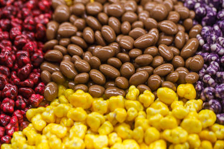Sweets in bulk, chocolate and in a multi-colored glazeの写真素材