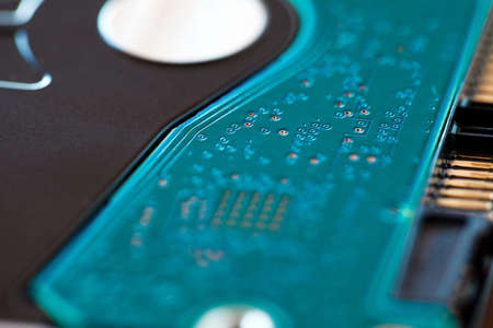 Electronic printed circuit board green on hard drive hdd, macro close-up, bokeh effect, selective...