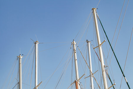 Masts tops and rope rigging accessory on yachts sailing vessels in the marina