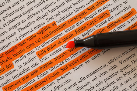 Lorem Ipsum text some lines are highlighted with orange marker stripes, selective focus, document preparationの写真素材