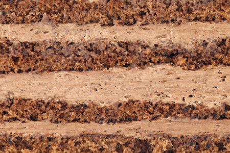 Truffle cake puff pastry layers of dough and cream close-up, background wallpaper, texture