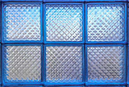 Frosted glass blue tile window, square glass blocks, background wallpaper, uniform texture patternの写真素材