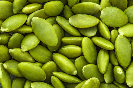 Pumpkin seeds close-up, green, in bulk, full depth of fieldの写真素材