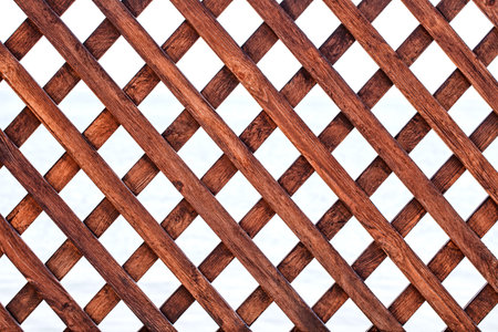 Grid of knocked-down lacquered wooden slats, square cellsの写真素材