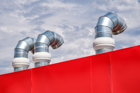 galvanized pipes of branching system installed on roof of building, close-upの写真素材