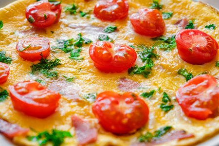 omelet with cherry tomatoes, close-up, selective focusの写真素材