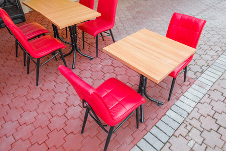 tables and red chairs in outdoor outdoor cafeの写真素材