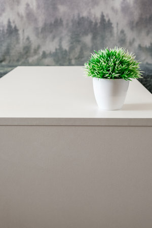 artificial flower on a white table