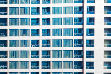 windows and balconies of high-rise residential building close-upの写真素材