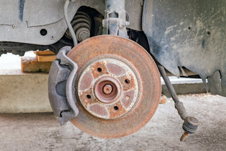 old car hub with rusty brake discの写真素材