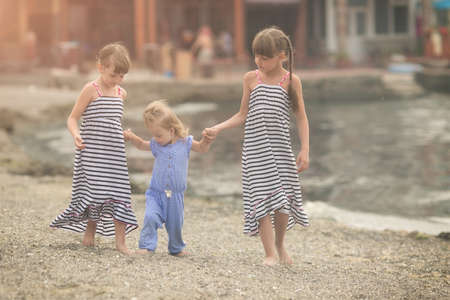 beautiful girl with Down syndrome is listening to music on headphonesの写真素材