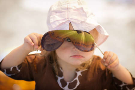 beautiful girl with Down syndrome is listening to music on headphonesの写真素材